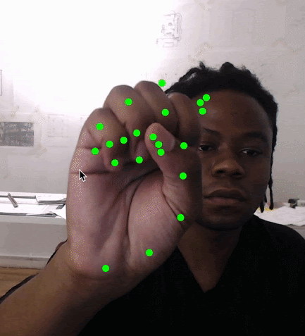 Bomani Oseni McClendon tests the HandPose model in ml5.js